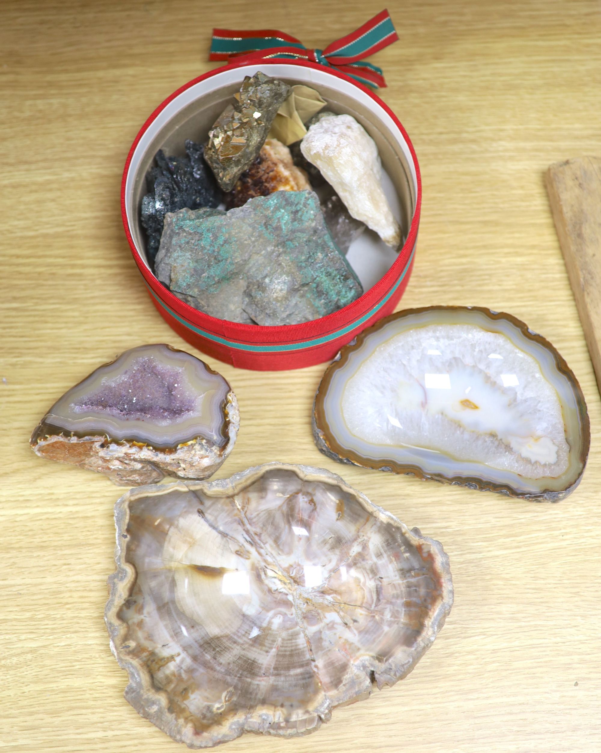 An amethyst geode section and assorted mineral specimens